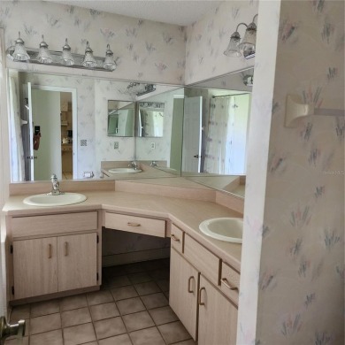 This meticulously maintained one owner home offers over 2,900 on The Grand Club - Pine Lakes Course in Florida - for sale on GolfHomes.com, golf home, golf lot