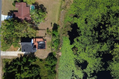 Across the street from a golf course, just off Hunter's Lake on Oak Hills Country Club in Florida - for sale on GolfHomes.com, golf home, golf lot