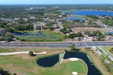 Across the street from a golf course, just off Hunter's Lake on Oak Hills Country Club in Florida - for sale on GolfHomes.com, golf home, golf lot