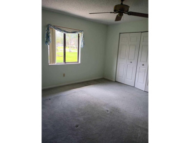 This meticulously maintained one owner home offers over 2,900 on The Grand Club - Pine Lakes Course in Florida - for sale on GolfHomes.com, golf home, golf lot
