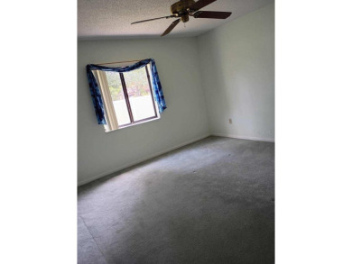 This meticulously maintained one owner home offers over 2,900 on The Grand Club - Pine Lakes Course in Florida - for sale on GolfHomes.com, golf home, golf lot