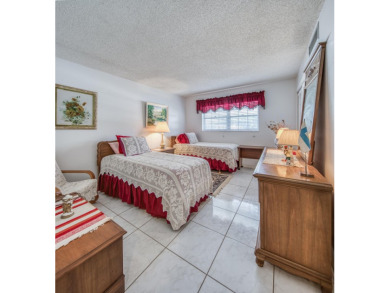 En-suite plus guest bedroom and bath with impressive room sizes on Atlantis Golf Club in Florida - for sale on GolfHomes.com, golf home, golf lot
