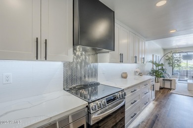 This fully REDESIGNED, Greek Isle-inspired upper-level condo in on Desert Forest Golf Club in Arizona - for sale on GolfHomes.com, golf home, golf lot