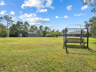 Under contract-accepting backup offers. Set on over an acre in on Wedgefield Golf Club in Florida - for sale on GolfHomes.com, golf home, golf lot