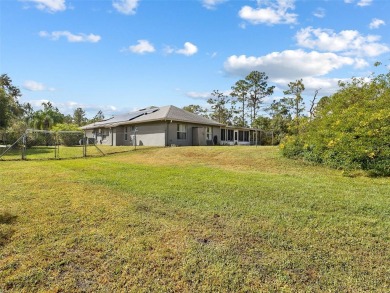 Under contract-accepting backup offers. Set on over an acre in on Wedgefield Golf Club in Florida - for sale on GolfHomes.com, golf home, golf lot