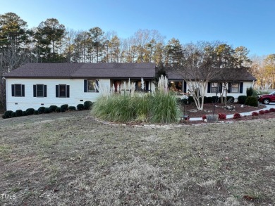 Spacious lake home on 2.9 acre lot with boat dock in place and for sale on GolfHomes.com