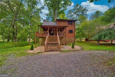 Riverfront living at itCOs finest with 110 feet of river on White Path Golf Club in Georgia - for sale on GolfHomes.com, golf home, golf lot