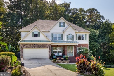 Price to move, this custom-built home sits on a roundabout on Hampton Golf Village in Georgia - for sale on GolfHomes.com, golf home, golf lot