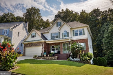 Price to move, this custom-built home sits on a roundabout on Hampton Golf Village in Georgia - for sale on GolfHomes.com, golf home, golf lot