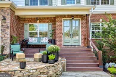 Price to move, this custom-built home sits on a roundabout on Hampton Golf Village in Georgia - for sale on GolfHomes.com, golf home, golf lot