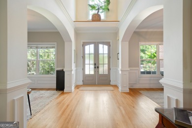 Price to move, this custom-built home sits on a roundabout on Hampton Golf Village in Georgia - for sale on GolfHomes.com, golf home, golf lot