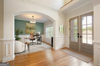 Price to move, this custom-built home sits on a roundabout on Hampton Golf Village in Georgia - for sale on GolfHomes.com, golf home, golf lot