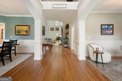 Price to move, this custom-built home sits on a roundabout on Hampton Golf Village in Georgia - for sale on GolfHomes.com, golf home, golf lot