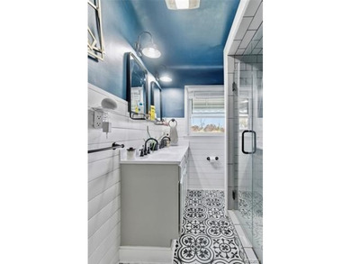 Enjoy a beautiful blend of comfort and character with this on Kearsley Lake Golf Course in Michigan - for sale on GolfHomes.com, golf home, golf lot