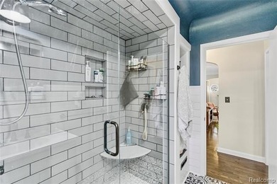 Enjoy a beautiful blend of comfort and character with this on Kearsley Lake Golf Course in Michigan - for sale on GolfHomes.com, golf home, golf lot