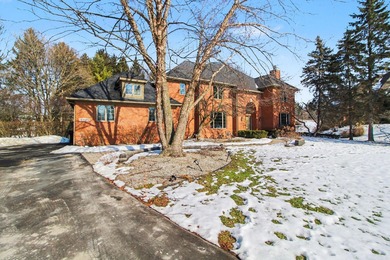 Nestled on a private, wooded half-acre cul-de-sac in the on Polo Fields Golf and Country Club in Michigan - for sale on GolfHomes.com, golf home, golf lot