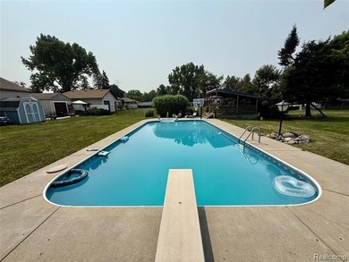 Enjoy a beautiful blend of comfort and character with this on Kearsley Lake Golf Course in Michigan - for sale on GolfHomes.com, golf home, golf lot