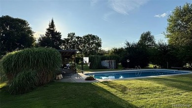 Enjoy a beautiful blend of comfort and character with this on Kearsley Lake Golf Course in Michigan - for sale on GolfHomes.com, golf home, golf lot