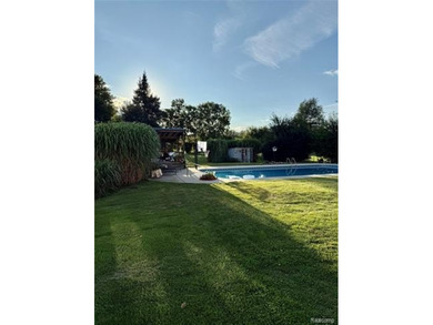 Enjoy a beautiful blend of comfort and character with this on Kearsley Lake Golf Course in Michigan - for sale on GolfHomes.com, golf home, golf lot