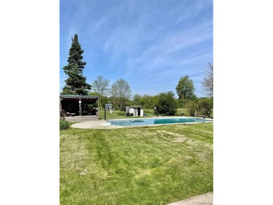 Enjoy a beautiful blend of comfort and character with this on Kearsley Lake Golf Course in Michigan - for sale on GolfHomes.com, golf home, golf lot