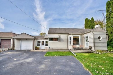 Enjoy a beautiful blend of comfort and character with this on Kearsley Lake Golf Course in Michigan - for sale on GolfHomes.com, golf home, golf lot