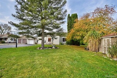 Enjoy a beautiful blend of comfort and character with this on Kearsley Lake Golf Course in Michigan - for sale on GolfHomes.com, golf home, golf lot