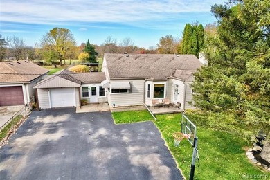 Enjoy a beautiful blend of comfort and character with this on Kearsley Lake Golf Course in Michigan - for sale on GolfHomes.com, golf home, golf lot