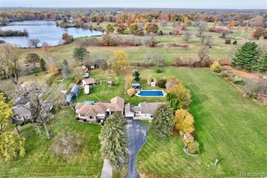Enjoy a beautiful blend of comfort and character with this on Kearsley Lake Golf Course in Michigan - for sale on GolfHomes.com, golf home, golf lot