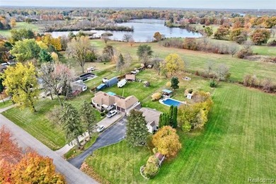 Enjoy a beautiful blend of comfort and character with this on Kearsley Lake Golf Course in Michigan - for sale on GolfHomes.com, golf home, golf lot
