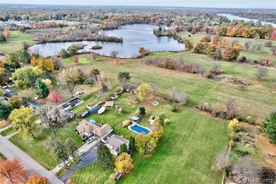 Enjoy a beautiful blend of comfort and character with this on Kearsley Lake Golf Course in Michigan - for sale on GolfHomes.com, golf home, golf lot