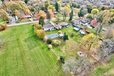 Enjoy a beautiful blend of comfort and character with this on Kearsley Lake Golf Course in Michigan - for sale on GolfHomes.com, golf home, golf lot