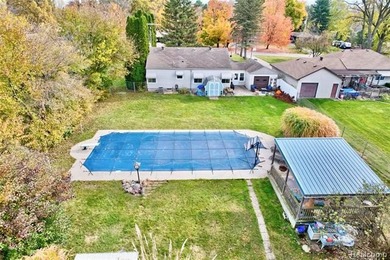 Enjoy a beautiful blend of comfort and character with this on Kearsley Lake Golf Course in Michigan - for sale on GolfHomes.com, golf home, golf lot