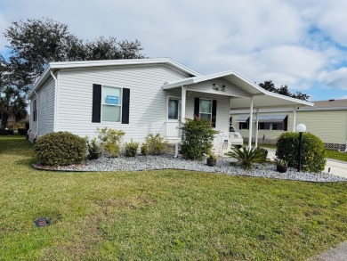 GORGEOUS 2-BEDROOM, 2-BATHROOM HOME LOCATED WITHIN WALKING on Cypress Greens in Florida - for sale on GolfHomes.com, golf home, golf lot