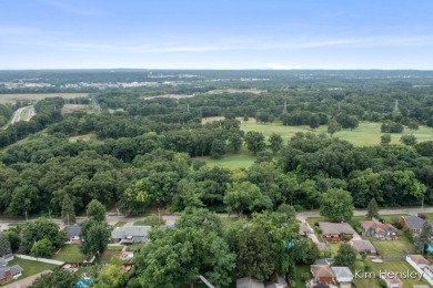 Welcome to 1819 Fulton Street NW! Situated on a serene street on Mines Golf Course in Michigan - for sale on GolfHomes.com, golf home, golf lot