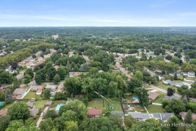 Welcome to 1819 Fulton Street NW! Situated on a serene street on Mines Golf Course in Michigan - for sale on GolfHomes.com, golf home, golf lot