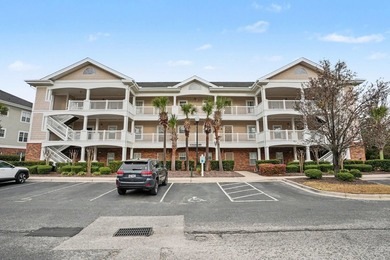 Welcome to this bright and beachy 2-bedroom, 2-bath end-unit on  in South Carolina - for sale on GolfHomes.com, golf home, golf lot