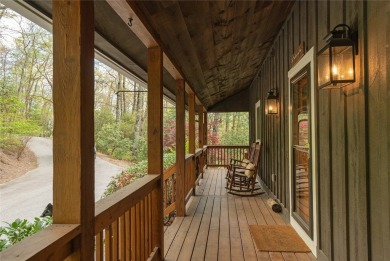 Experience breathtaking long-range mountain views and a serene on Sapphire National Golf Club in North Carolina - for sale on GolfHomes.com, golf home, golf lot