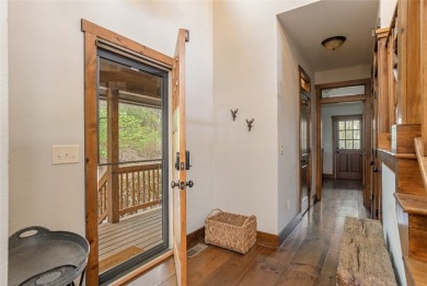 Experience breathtaking long-range mountain views and a serene on Sapphire National Golf Club in North Carolina - for sale on GolfHomes.com, golf home, golf lot