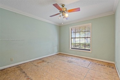Incredible opportunity to own a spacious 4-bedroom plus on Country Club of Coral Springs in Florida - for sale on GolfHomes.com, golf home, golf lot