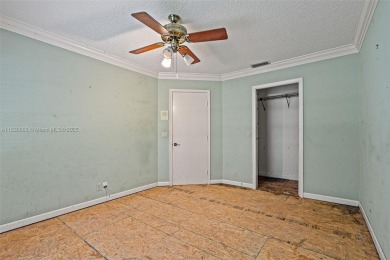 Incredible opportunity to own a spacious 4-bedroom plus on Country Club of Coral Springs in Florida - for sale on GolfHomes.com, golf home, golf lot