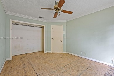 Incredible opportunity to own a spacious 4-bedroom plus on Country Club of Coral Springs in Florida - for sale on GolfHomes.com, golf home, golf lot