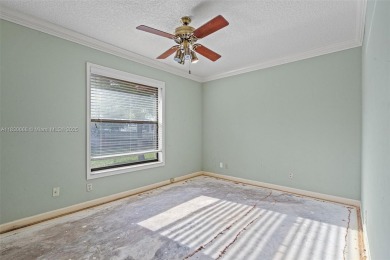 Incredible opportunity to own a spacious 4-bedroom plus on Country Club of Coral Springs in Florida - for sale on GolfHomes.com, golf home, golf lot