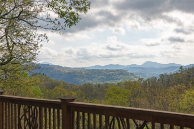 Experience breathtaking long-range mountain views and a serene on Sapphire National Golf Club in North Carolina - for sale on GolfHomes.com, golf home, golf lot