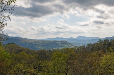Experience breathtaking long-range mountain views and a serene on Sapphire National Golf Club in North Carolina - for sale on GolfHomes.com, golf home, golf lot