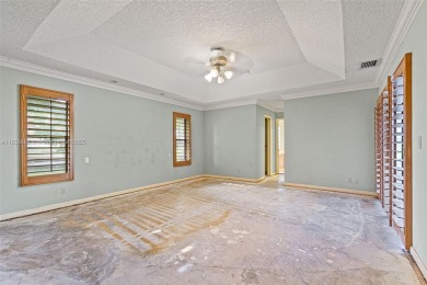 Incredible opportunity to own a spacious 4-bedroom plus on Country Club of Coral Springs in Florida - for sale on GolfHomes.com, golf home, golf lot