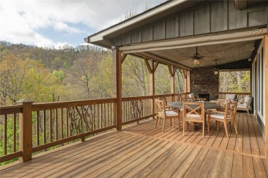 Experience breathtaking long-range mountain views and a serene on Sapphire National Golf Club in North Carolina - for sale on GolfHomes.com, golf home, golf lot