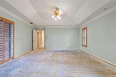 Incredible opportunity to own a spacious 4-bedroom plus on Country Club of Coral Springs in Florida - for sale on GolfHomes.com, golf home, golf lot
