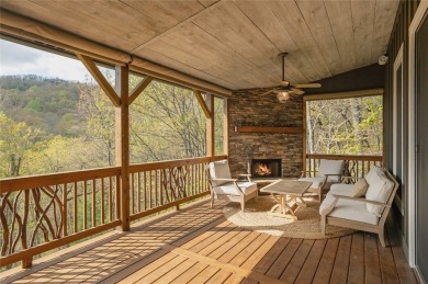Experience breathtaking long-range mountain views and a serene on Sapphire National Golf Club in North Carolina - for sale on GolfHomes.com, golf home, golf lot