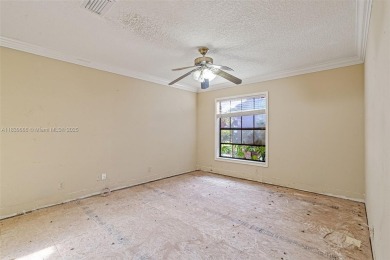 Incredible opportunity to own a spacious 4-bedroom plus on Country Club of Coral Springs in Florida - for sale on GolfHomes.com, golf home, golf lot