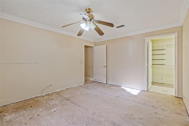 Incredible opportunity to own a spacious 4-bedroom plus on Country Club of Coral Springs in Florida - for sale on GolfHomes.com, golf home, golf lot